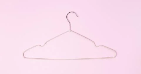 Creative flat lay hanger pastel pink background. Sale discount store promo sh Stock Photos