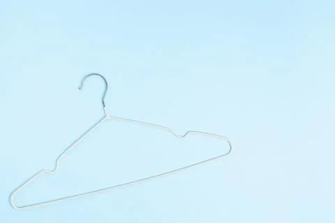 Creative flat lay hanger pastel blue background. Sale discount store promo sh Stock Photos