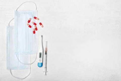 Creative flat lay overhead composition with disposable face masks, electronic Stock Photos