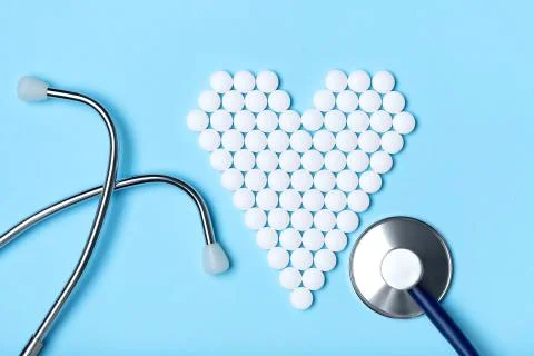 Creative flat lay overhead composition with stethoscope and heart made of whi Stock Photos