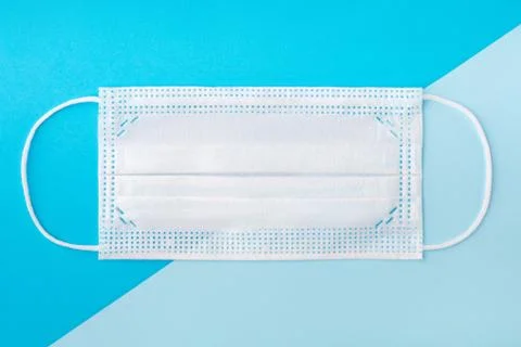 Creative flat lay overhead composition with medical disposable face mask Stock Photos