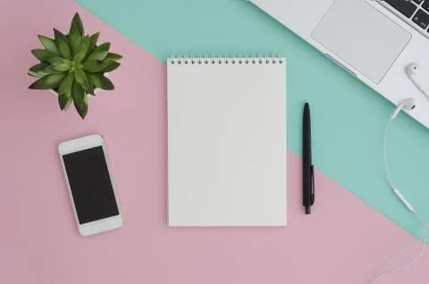 Creative flat lay photo of workspace desk with smartphone, eyeglasses, earphones Stock Photos