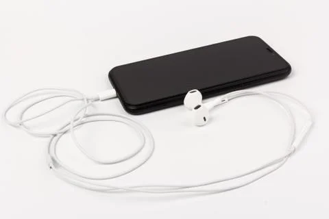 Creative flat lay photo of workspace desk with earphones and mobile phone Stock Photos