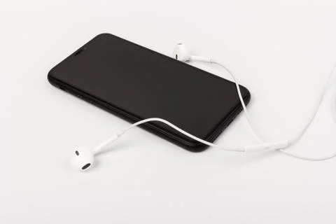 Creative flat lay photo of workspace desk with earphones and mobile phone Foto stock