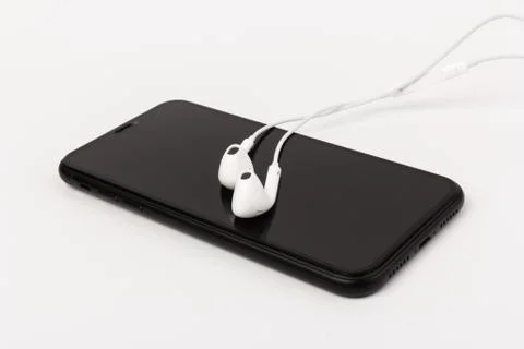 Creative flat lay photo of workspace desk with earphones and mobile phone Stock Photos
