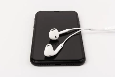 Creative flat lay photo of workspace desk with earphones and mobile phone Foto stock