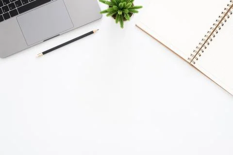 Creative flat lay photo of workspace desk. Top view office desk with laptop.. Stock Photos