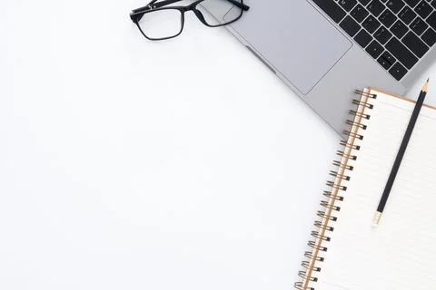 Creative flat lay photo of workspace desk. Top view office desk with laptop.. Stock Photos