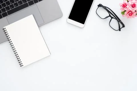 Creative flat lay photo of workspace desk. Top view office desk with laptop.. Stock Photos