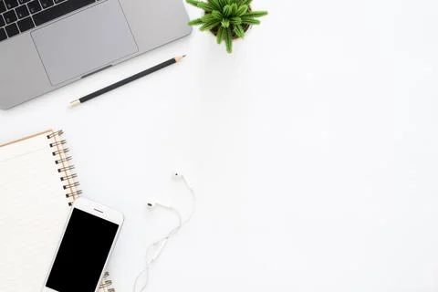 Creative flat lay photo of workspace desk. Top view office desk with laptop.. Stock Photos