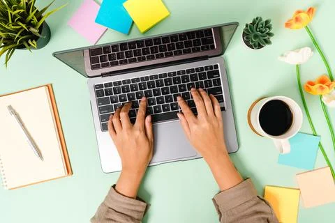 Creative flat lay photo of workspace desk. Top view office desk with laptop.. Stock Photos