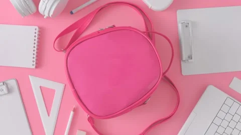 Creative flat lay with pink backpack and school supplies. Stock Footage 201193119