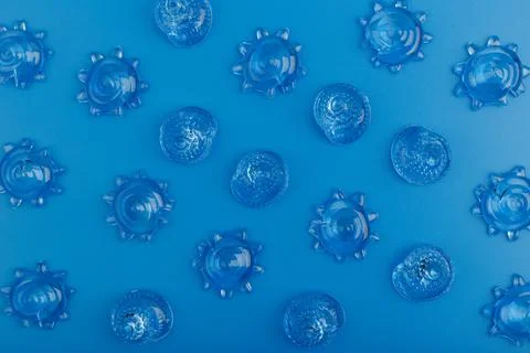 Creative flat lay with sea shells on blue background. Summer composition Stock Photos