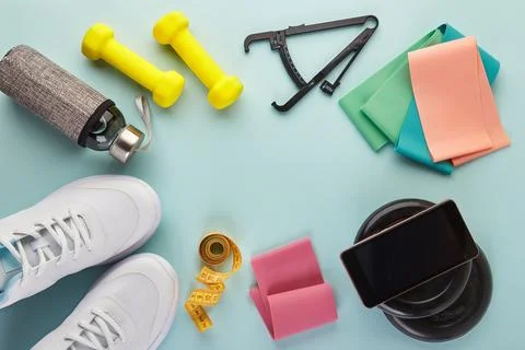 Creative flat lay of sport and fitness equipments. Stock Photos