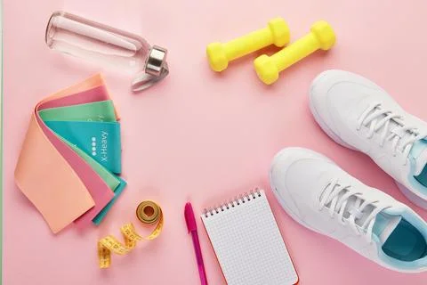 Creative flat lay of sport and fitness equipments. Stock Photos