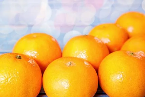 Creative flat lay top view of fresh orange fruit on blue wooden background with Foto stock