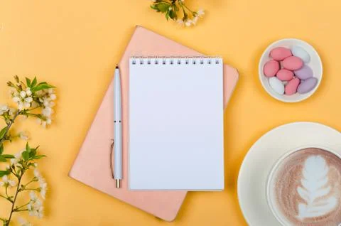 Creative flat lay of workspace desk, notepad and lifestyle objects on yellow  Stock Photos