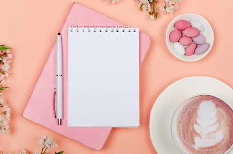 Creative flat lay of workspace desk, notepad and lifestyle objects on pink ba Stock Photos