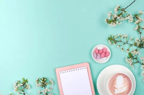 Creative flat lay of workspace desk, notepad and lifestyle objects on green b Stock Photos