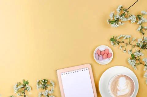 Creative flat lay of workspace desk, notepad and lifestyle objects on yellow Stock Photos