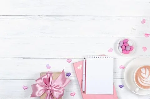 Creative flat lay of workspace desk, notepad and present and lifestyle objects Stock Photos