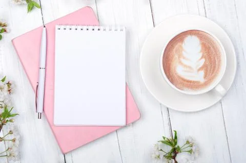 Creative flat lay of workspace desk, notepad on wooden background Stock Photos