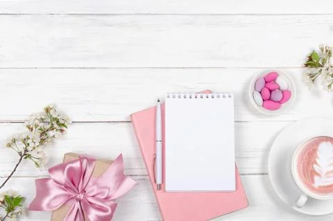 Creative flat lay of workspace desk, notepad and lifestyle objects on wooden Stock Photos