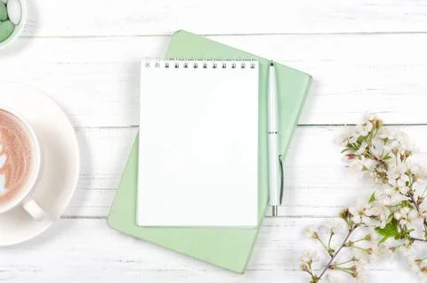 Creative flat lay of workspace desk, notepad on wooden background Stock Photos