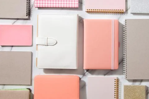 Creative flat lay of workspace desk with neatly arranged various coral, grey Stock Photos