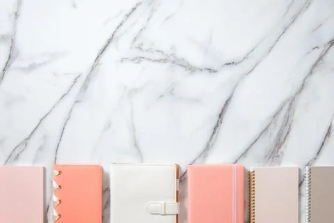 Creative flat lay of workspace desk with neatly arranged various coral, grey Stock Photos