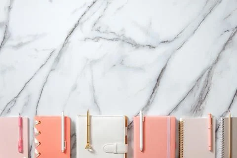 Creative flat lay of workspace desk with neatly arranged various coral, grey Stock Photos