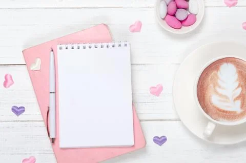 Creative flat lay of workspace, notepad and lifestyle objects on wooden backg Stock Photos