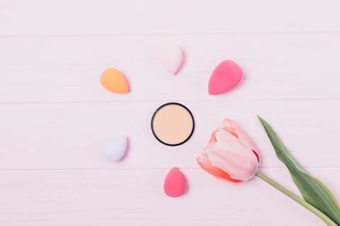 Creative flat layout of cosmetic beige foundation Stock Photos