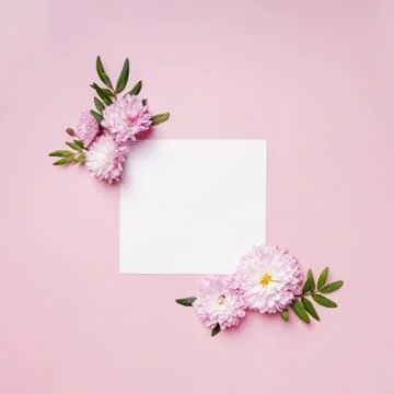 Creative floral composition with blank paper in the centre. Stock Photos