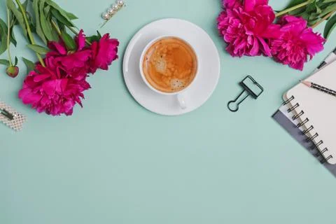 Creative frame with coffee, peonies and feminine accessories Stock Photos