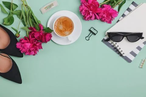 Creative frame with coffee, peonies and feminine accessories Stock Photos
