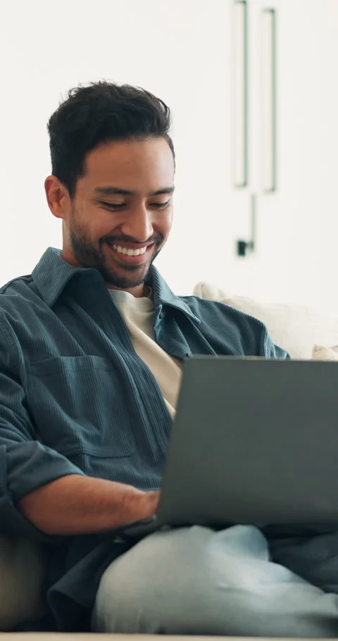Creative, freelancer and happy man with laptop in lounge, graphic designer or Stock Footage 340882260