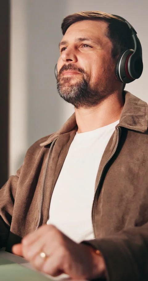 Creative, freelancer and man with headphones in home office, dancing and Stock Footage 337545207