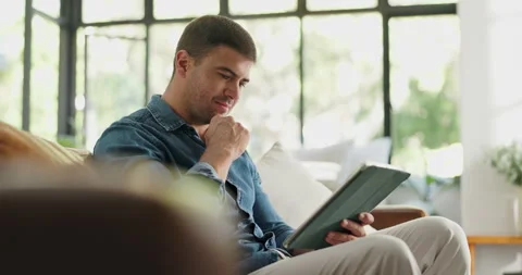 Creative, freelancer and man with tablet, lounge and copywriting on social media Stock Footage 329453497