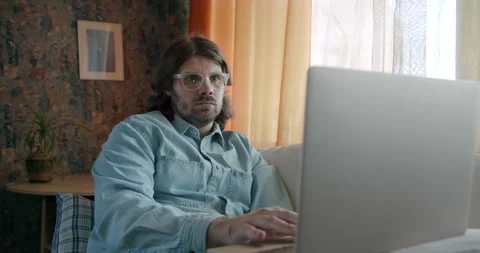 Creative freelancer man working at home with laptop using Artificial intelligenc Stock Footage 245807201