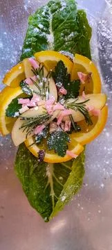 Creative Fruit and Herb Garnish on Leaf with Sugar Dust Stock Photos