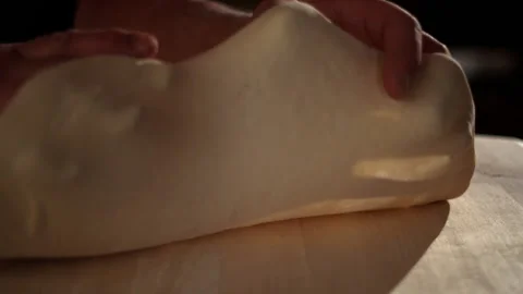 Creative Fun Shot of Pizza Dough Being Placed Down Video stock 130400679