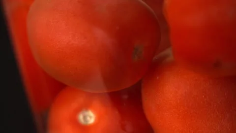 Creative Fun Shot of Tomatoes Draining in Slow Motion Video stock 130399285