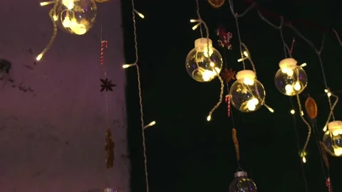Creative garland of glass balls with burning bulbs inside. Stock Footage 165583467