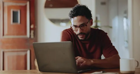 Creative, glasses and man with laptop, home or research for article, remote work 動画素材 335809228