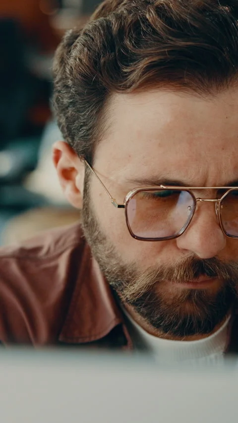 Creative, glasses and man with laptop in business, copywriting or planning for Stock Footage 338190961