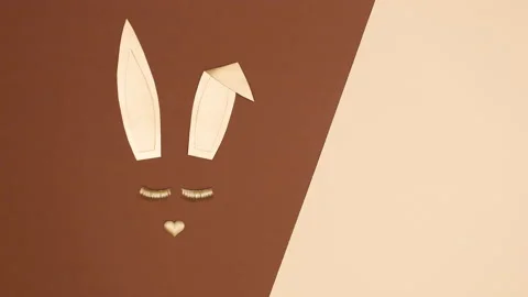 Creative Golden Easter bunny blinking with eye lashes. Stop motion Stock Footage 150284297