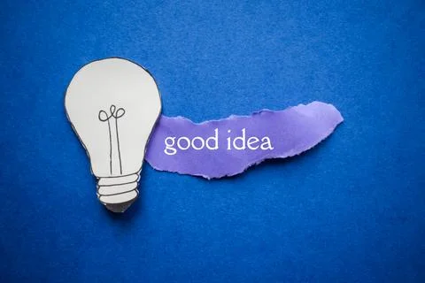 Creative Good Idea Concept with Lightbulb and Purple Paper Stock Photos