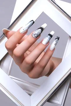 Creative gradient design of nails on female hands. Art manicure. Stock Photos