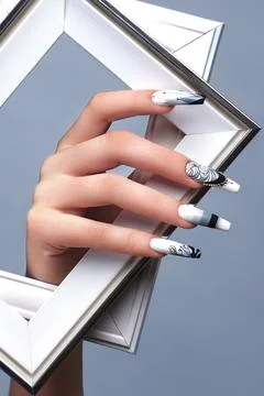 Creative gradient design of nails on female hands. Art manicure. Stock Photos
